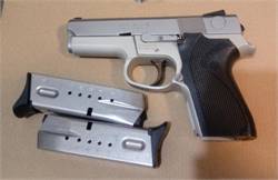 9mm S&W 6946 . compact and not too heavy . EXCELLENT with 2 magazines